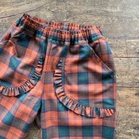 homspun  ウールタータンフリルポケットPT