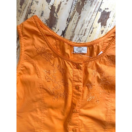 orange sleeveless tops