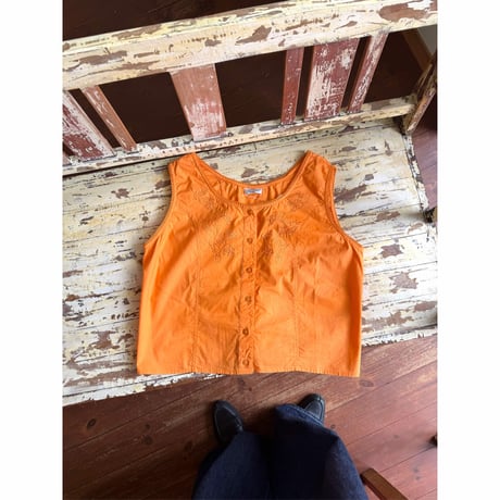 orange sleeveless tops