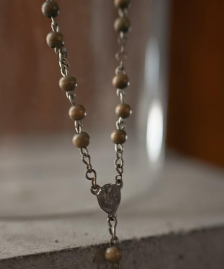 Subtle "Jesus christ" Dark beige beads.