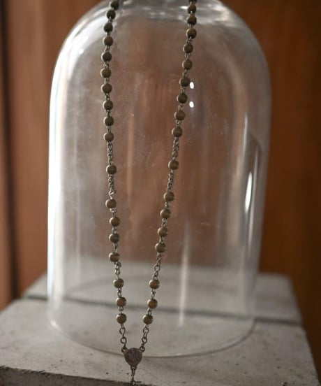 Subtle "Jesus christ" Dark beige beads.