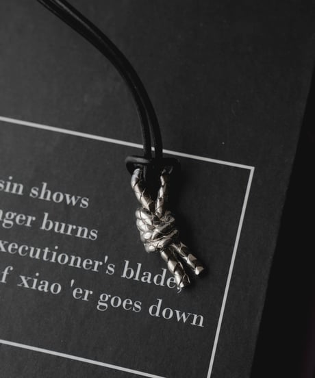 LEATHER CORD DOUBLE KNOT ORNAMENT