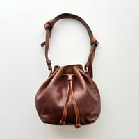 brown leather round shoulder bag