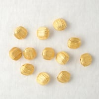 糸巻き模様のゴールドボタン