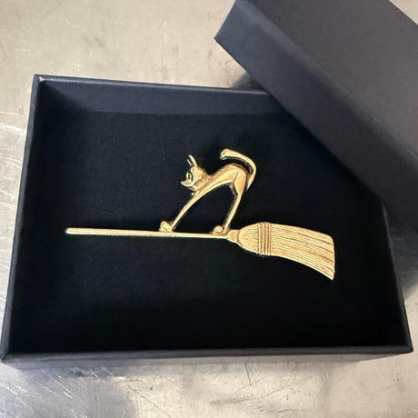 Cat and broom brooch