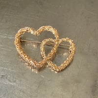 Double heart brooch