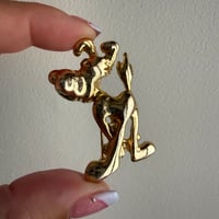 Dog gold color brooch