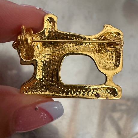 Sewing machine brooch
