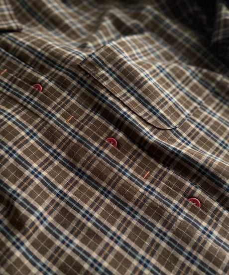catching red button shirt