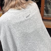 embroidery logo over sweat