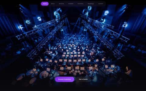 Krank'd orchestral stage shot from above, full orchestra in deep blue wash with stage truss visible