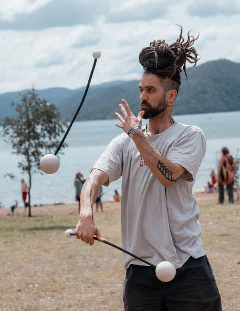 Flow arts performer at a daytime bush festival