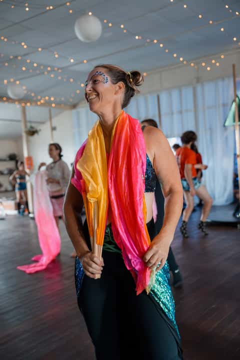 Flow-arts group fan dance at a festival