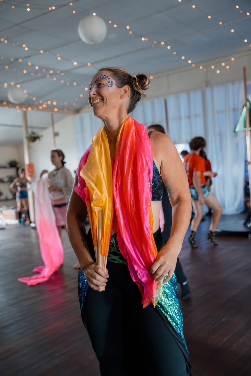 Flow-arts group fan dance at a festival