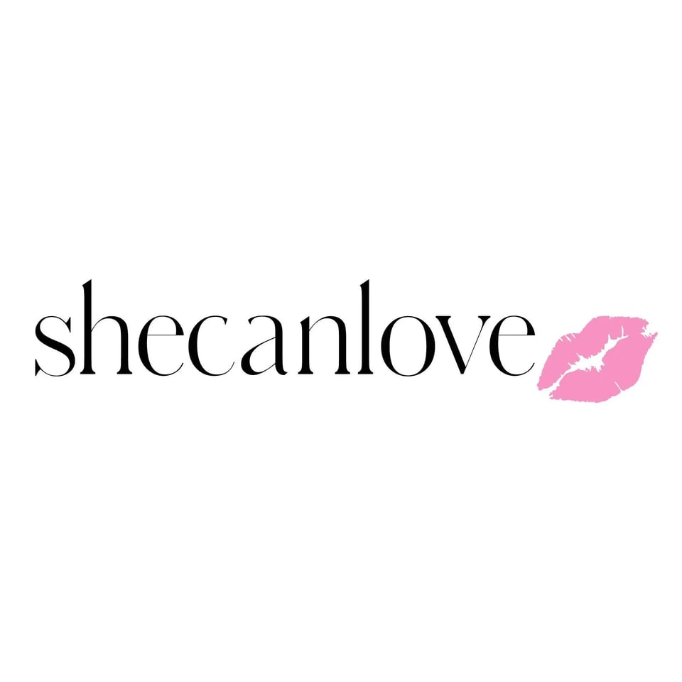 shecanlove logo with black serif lettering and a pink lipstick kiss mark