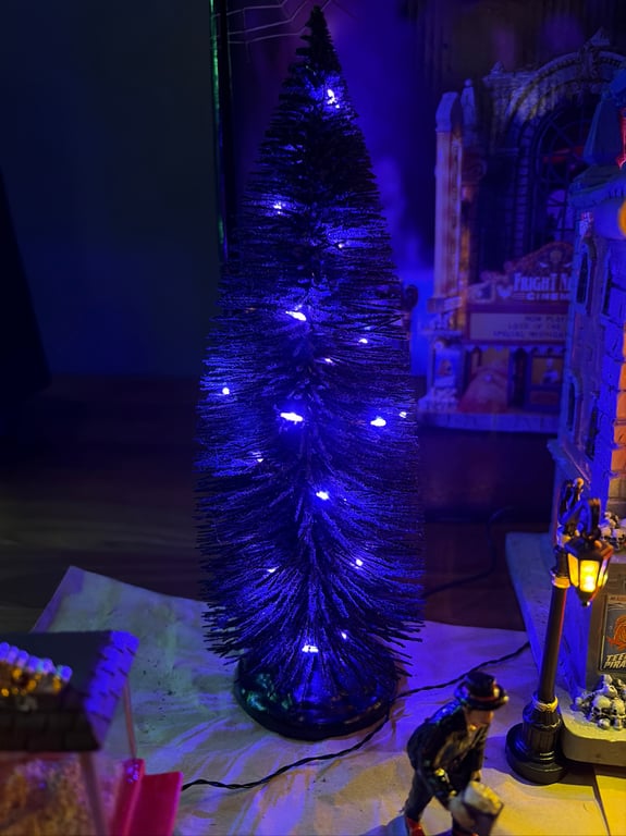 Black Bristle Tree With Purple Lights