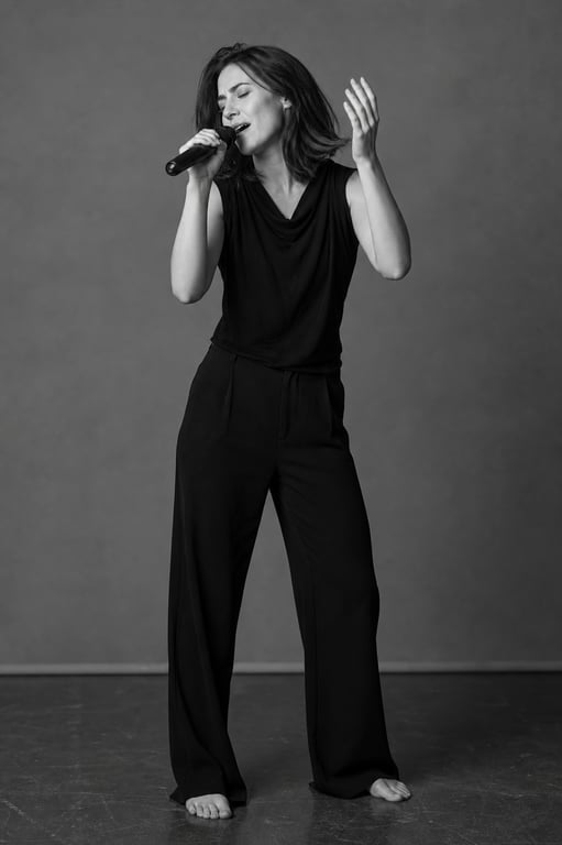 Black And White Solo Female Singer Contemporary Dance Brutalist Hall Storyboard reference image
