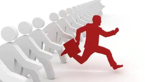 A red figure of a buyer agent running ahead of white figures, symbolizing a unique value proposition in real estate.