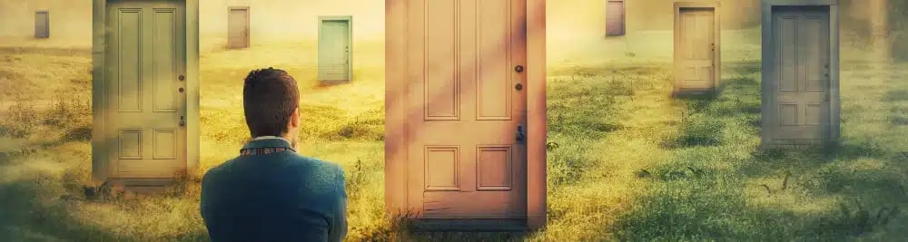 Person standing in front of multiple doors in a field, symbolizing the decision-making process of choosing a real estate