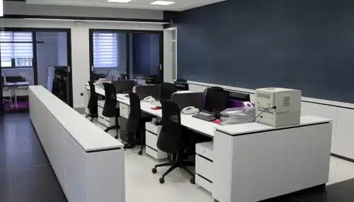 Modern office space with desks and chairs, illustrating the importance of office space considerations in brokerage interview