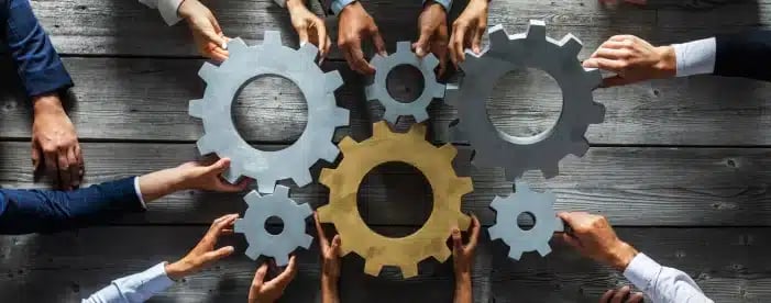 gears being held together by human hands