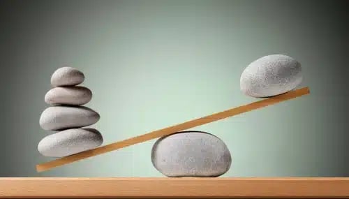 real estate buyer agent problems are unbalanced now, displayed through a close-up of a balance
