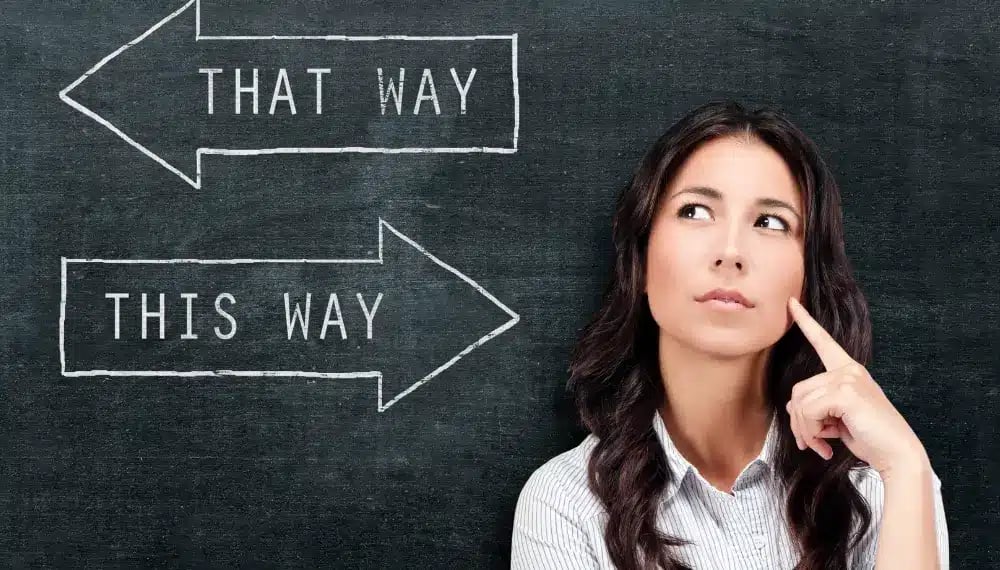 A woman contemplating her choices with signs pointing in opposite directions,