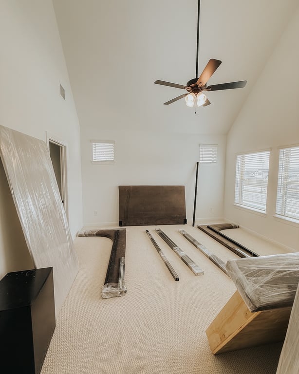 Bedroom With Tv And Blinds