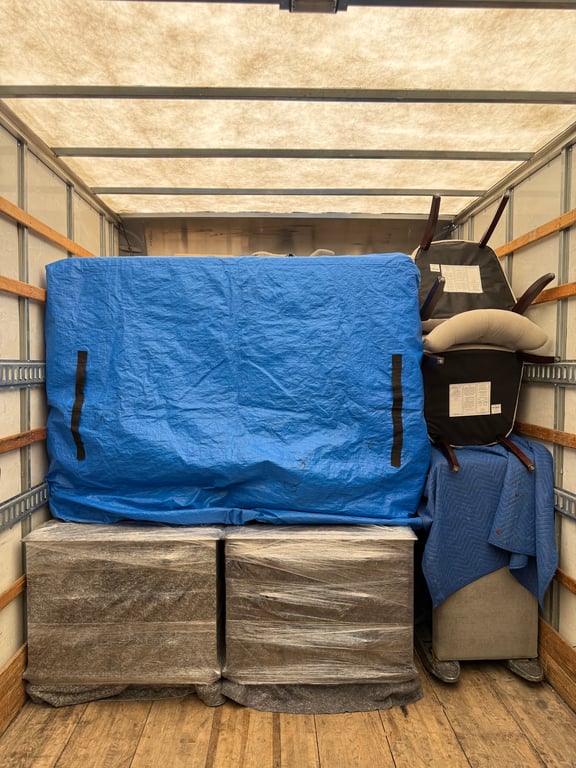Moving Truck Interior Blue Tarp Covered Item