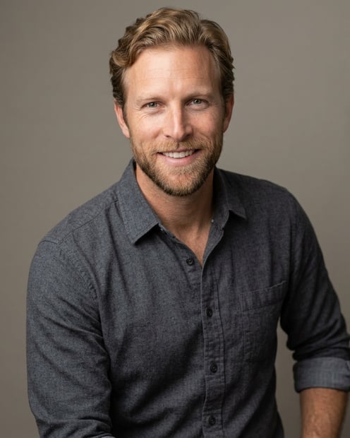 Warm Grey Studio Sweep · Charcoal Button-Up with Rolled Sleeves headshot example