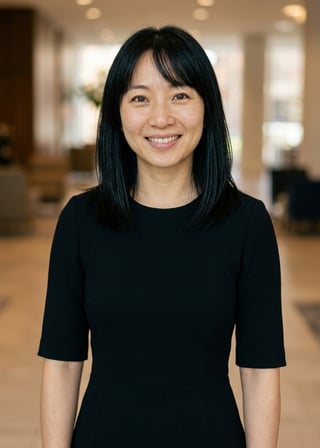 Professional AI LinkedIn headshot in Black midi fitted dress on Lobby (corporate lobby)