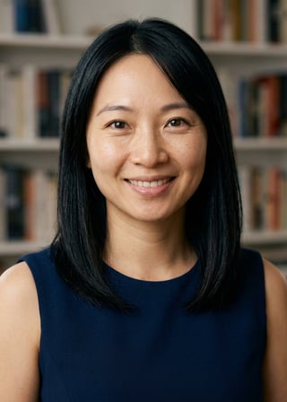 Professional AI LinkedIn headshot in Navy blue sleeveless dress on Bookshelf (thought-leader)