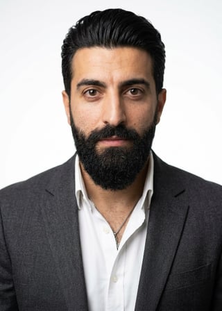 Professional AI LinkedIn headshot in Charcoal gray blazer on White / Pure White Studio