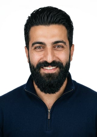 Professional AI LinkedIn headshot in Navy quarter-zip pullover on White / Pure White Studio