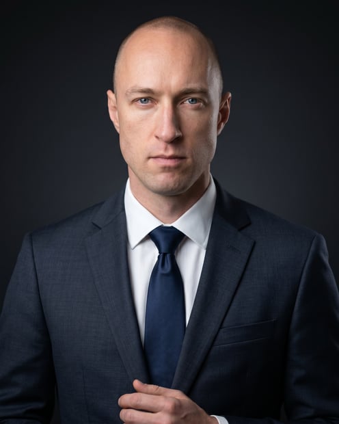 Charcoal Low-Key Studio · Dark Litigation Suit headshot example