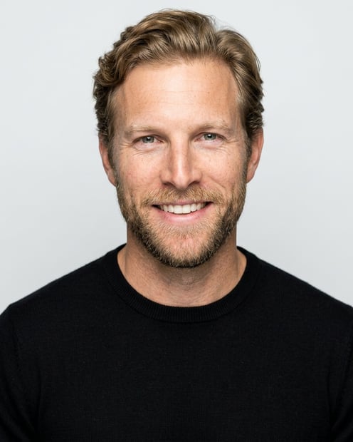 Soft White to Light Grey Studio · Black Long-Sleeve Knit Top headshot example
