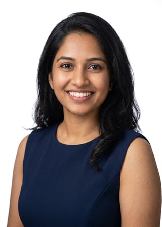 Professional AI LinkedIn headshot in Navy blue sleeveless dress on White / Pure White Studio