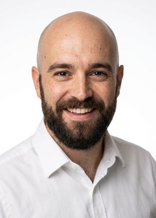 Professional AI LinkedIn headshot in White button-up shirt on White / Pure White Studio