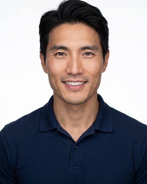 White / Pure White Studio · Navy blue short-sleeve polo headshot example