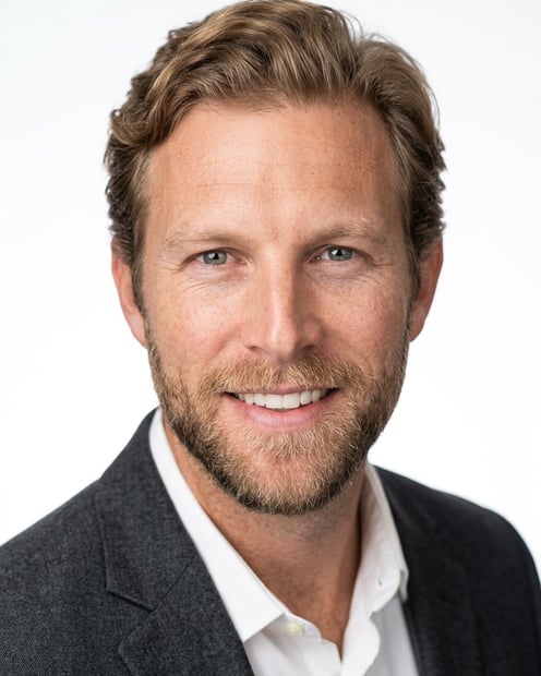 White / Pure White Studio · Charcoal gray blazer headshot example