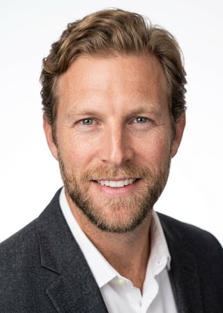 Professional AI LinkedIn headshot in Charcoal gray blazer on White / Pure White Studio