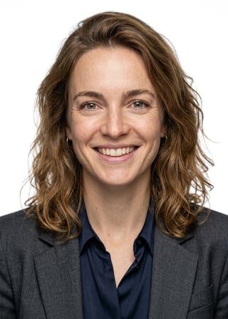 Professional AI LinkedIn headshot in Charcoal gray blazer on White / Pure White Studio