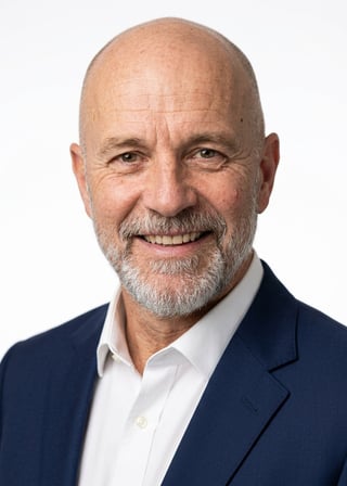 Professional AI LinkedIn headshot in Navy tailored suit on White / Pure White Studio
