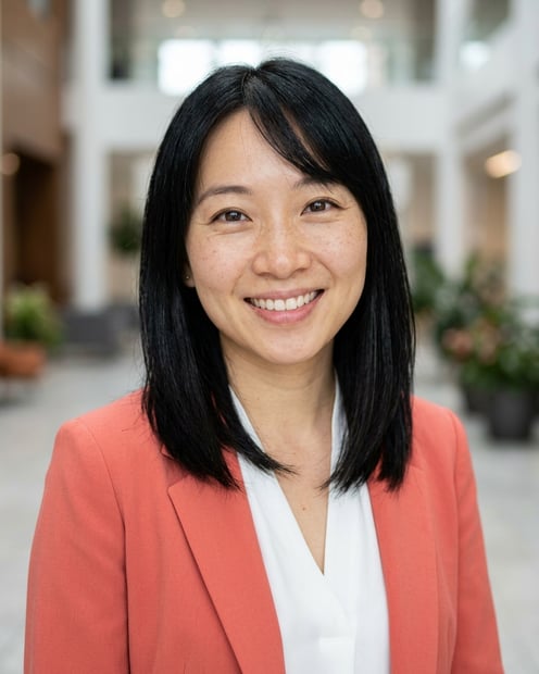 Lobby · Coral blazer over white blouse headshot example