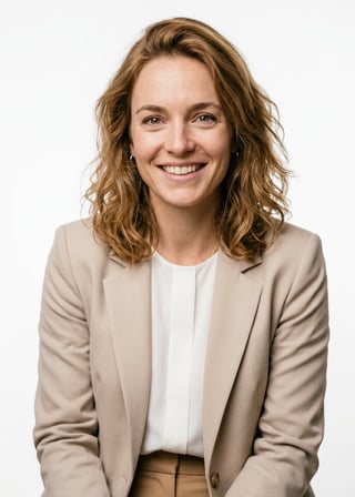 Professional AI LinkedIn headshot in Light beige blazer and tan trousers ensemble on White / Pure White Studio