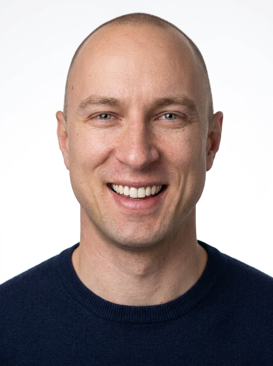 Professional AI LinkedIn headshot in Navy blue crew-neck sweater on White / Pure White Studio