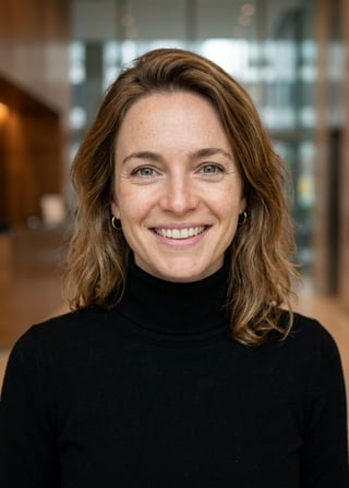 Professional AI LinkedIn headshot in Fitted black turtleneck on Lobby (corporate lobby)