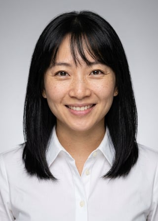 Professional AI LinkedIn headshot in White button-up shirt on Neutral Gradient / Light Grey