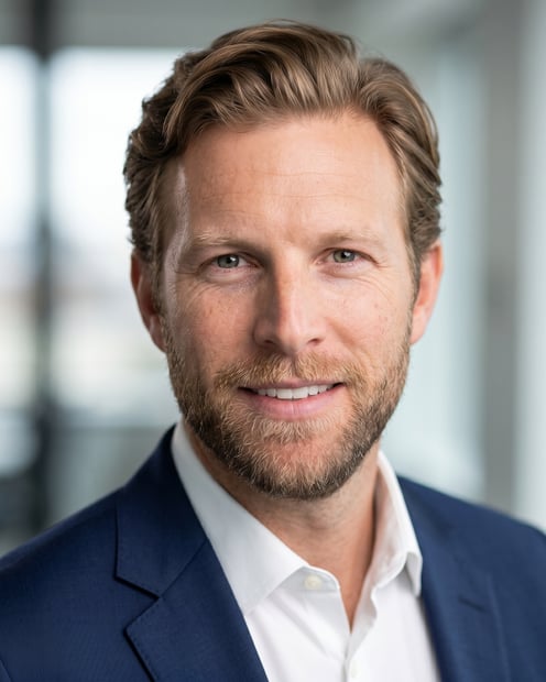 Office / Modern Office Workspace · Navy tailored suit headshot example