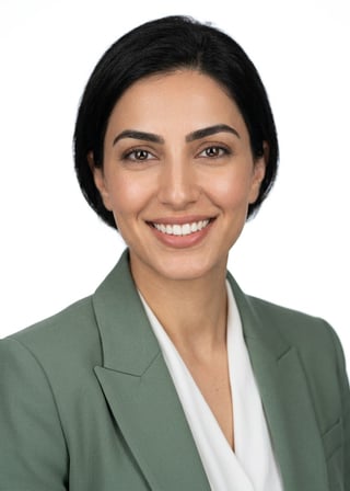 Professional AI LinkedIn headshot in Sage green blazer with white blouse (2026 trend) on White / Pure White Studio